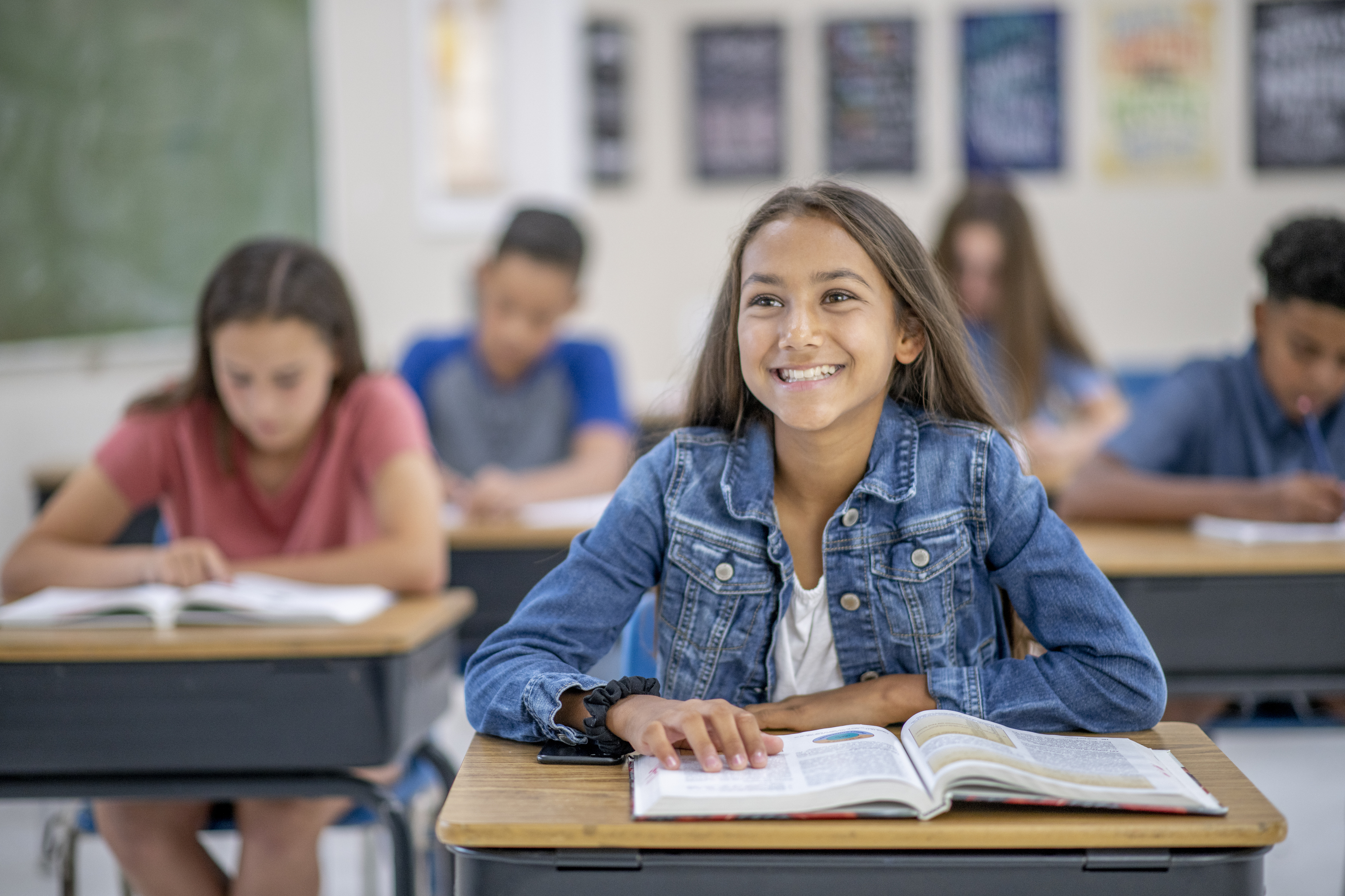 Young girl in classroom. Young girl in classroom.